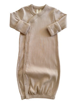Beige ribbed baby gown with long sleeves and snap buttons, suitable for newborns.