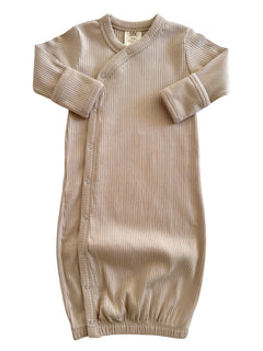 Beige ribbed baby gown with long sleeves and snap buttons, suitable for newborns.