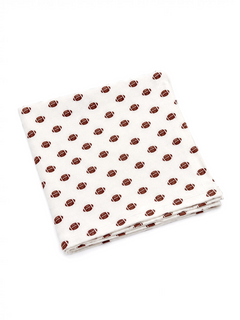 White cloth with a repeating pattern of brown footballs, folded neatly.