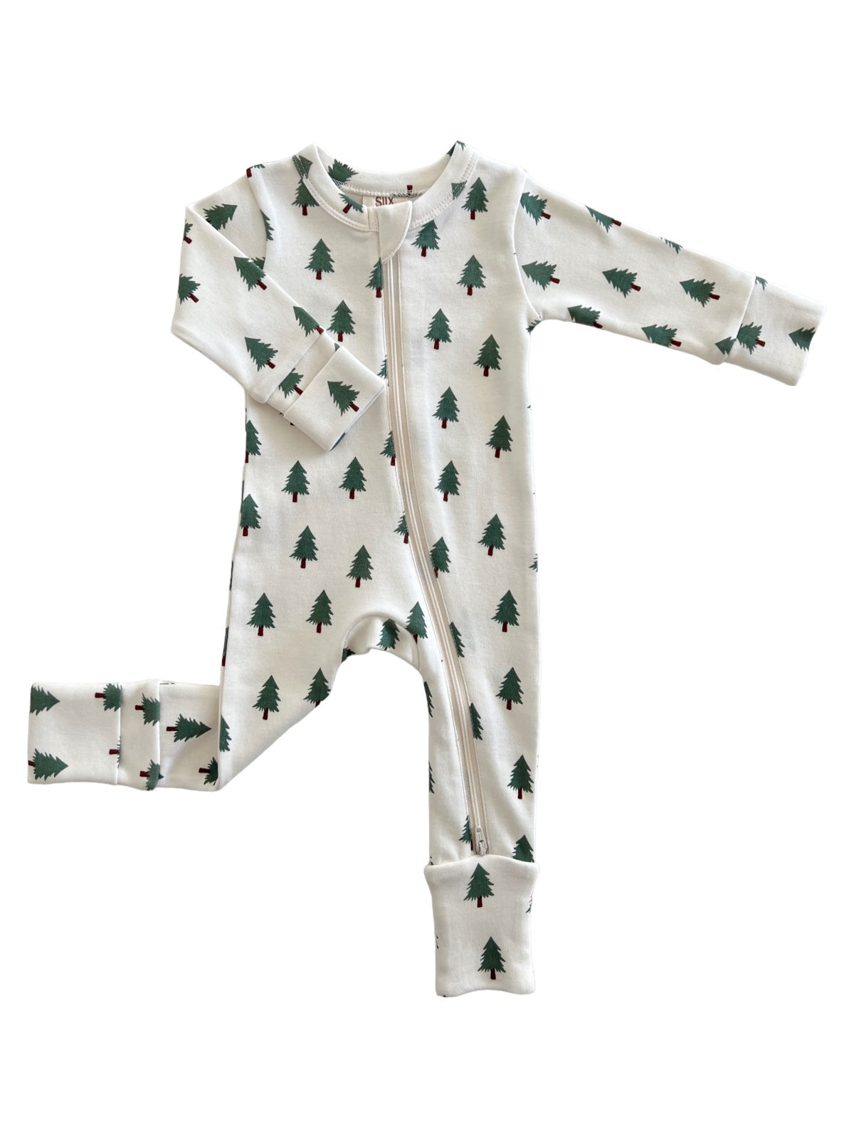 White baby onesie with green pine tree prints, featuring a front zipper and long sleeves.