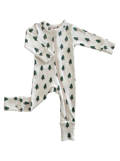 White baby onesie with green pine tree prints, featuring a front zipper and long sleeves.