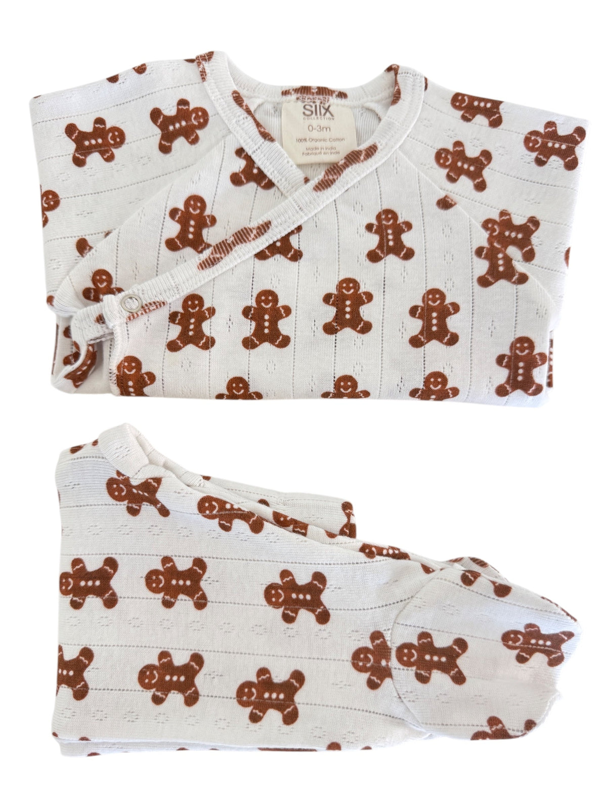 Gingerbread-themed infant outfit featuring a top and matching footed pants.