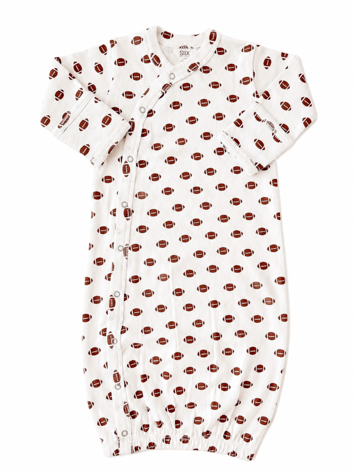 White baby gown with brown football print and snap closures. Ideal for comfortable sleepwear.