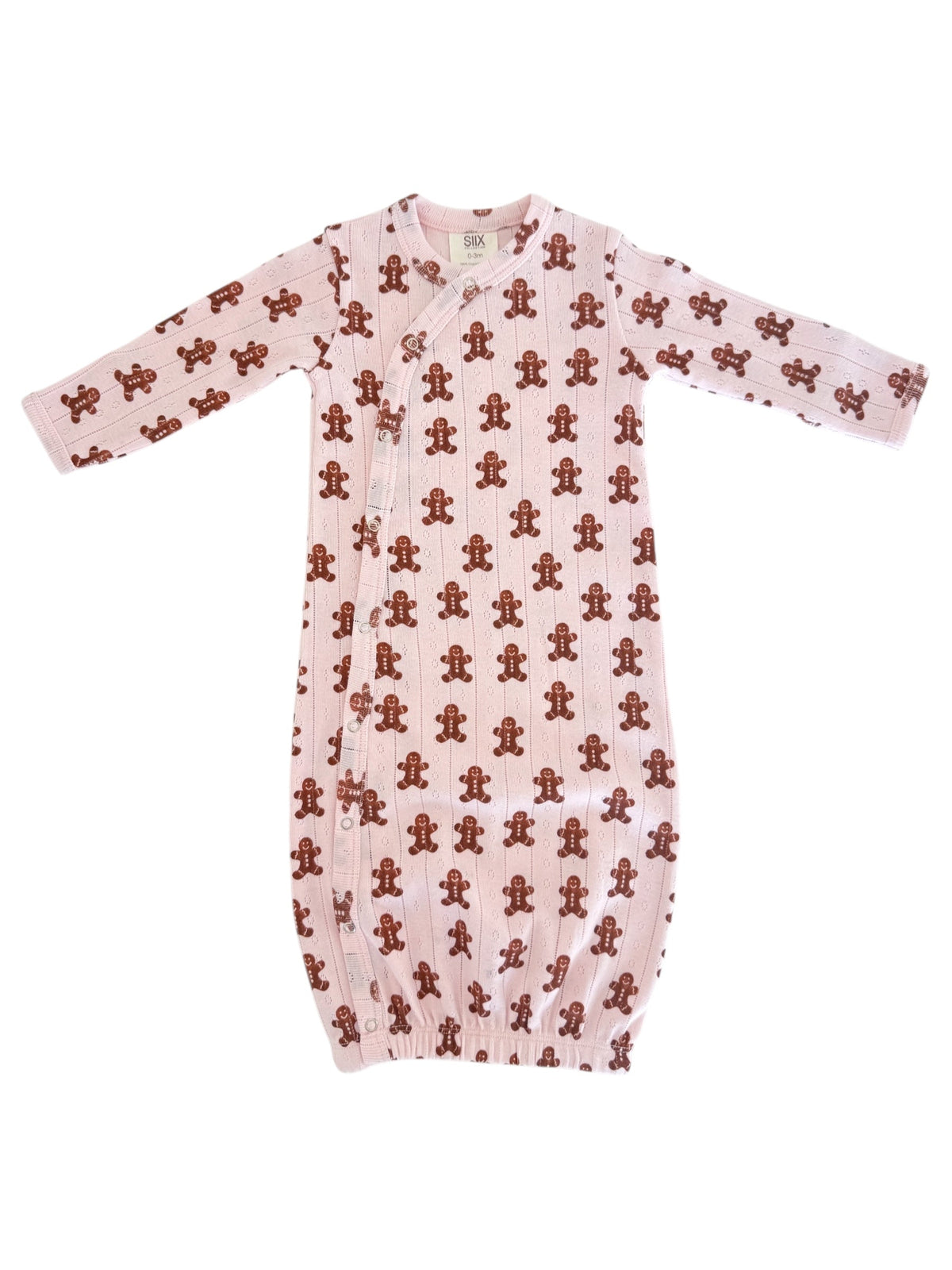 Pink baby sleeper gown with brown gingerbread man print and long sleeves, featuring snap buttons along the side.