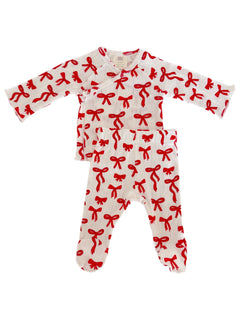 Red and white children’s outfit featuring a top and pants with a bow print. Perfect for cozy, stylish wear.