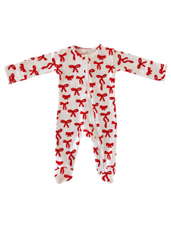 White baby onesie with red bow pattern and long sleeves, featuring a front zipper closure.