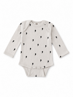 Gray long-sleeve baby onesie with black lightning bolt pattern and snap closure at the bottom.