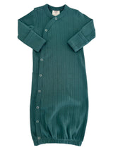 Teal baby gown with long sleeves and snap closures, featuring a ribbed texture and gathered hem.