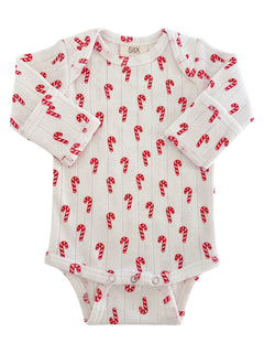 White baby onesie with red candy cane patterns, perfect for festive occasions. Long sleeves and button closures at the bottom.