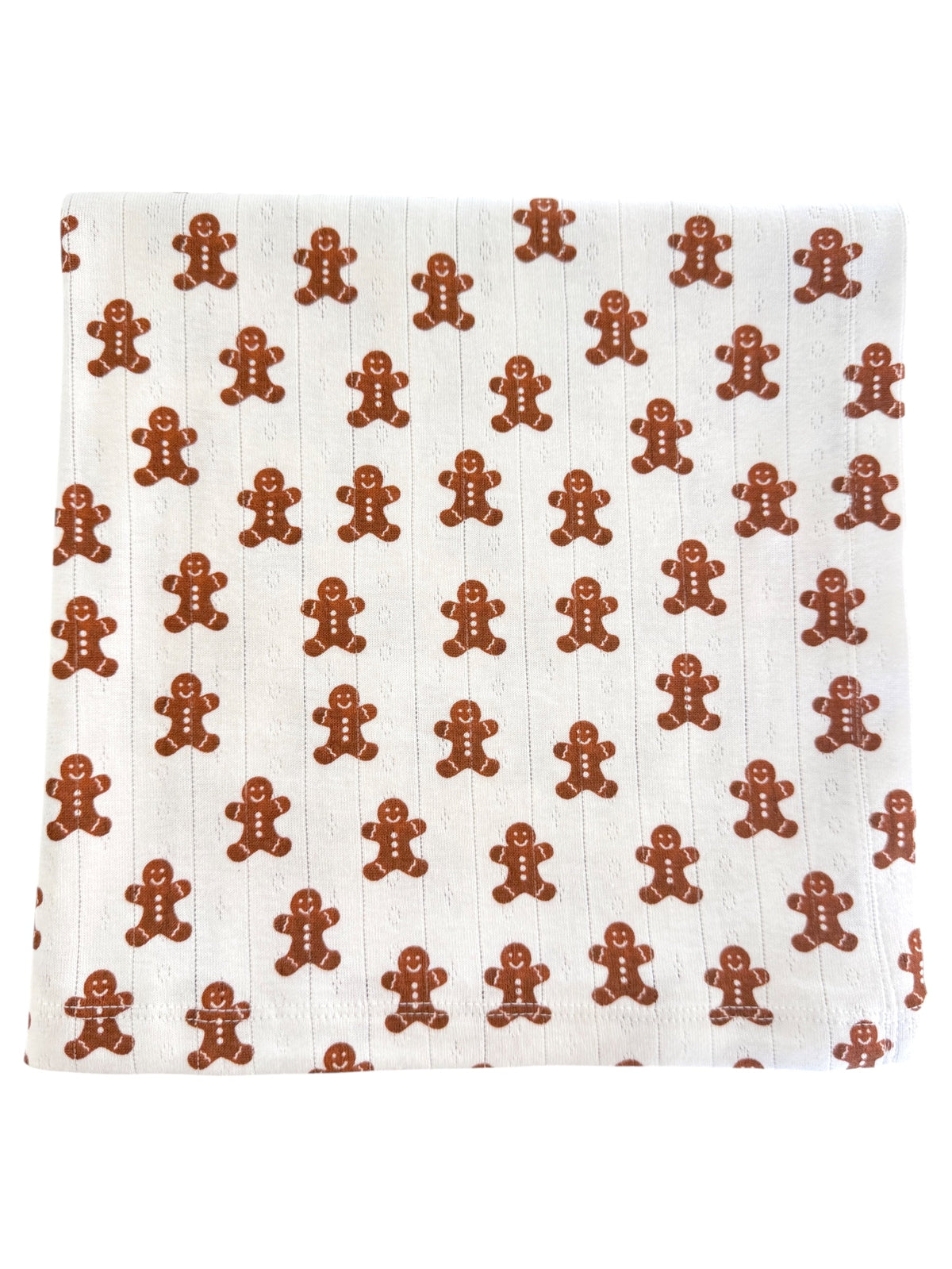 Patterned fabric featuring repeating gingerbread man designs in brown on a light background.