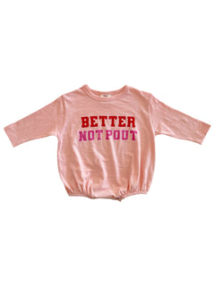 Pink long-sleeve shirt with the text "BETTER NOT POUT" in red and pink letters across the front.