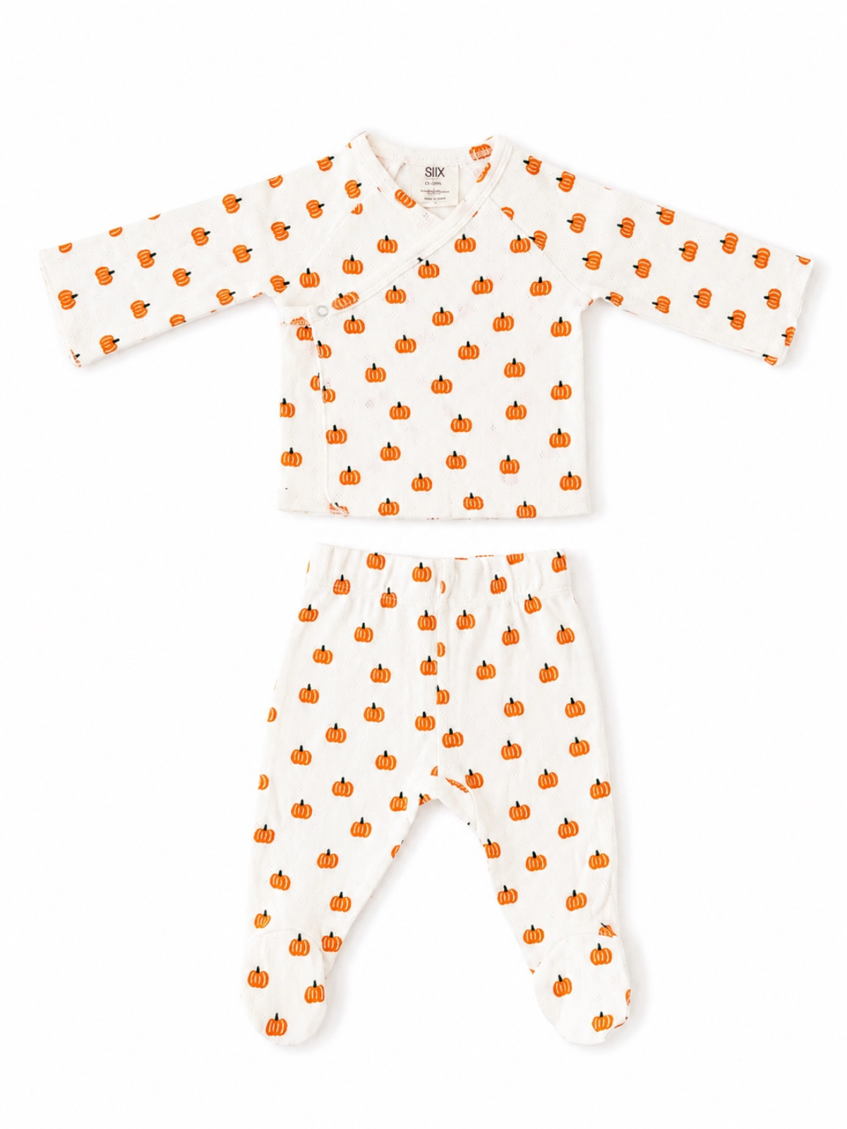 White baby outfit with pumpkin prints, featuring a long-sleeve top and matching pants. Perfect for fall.