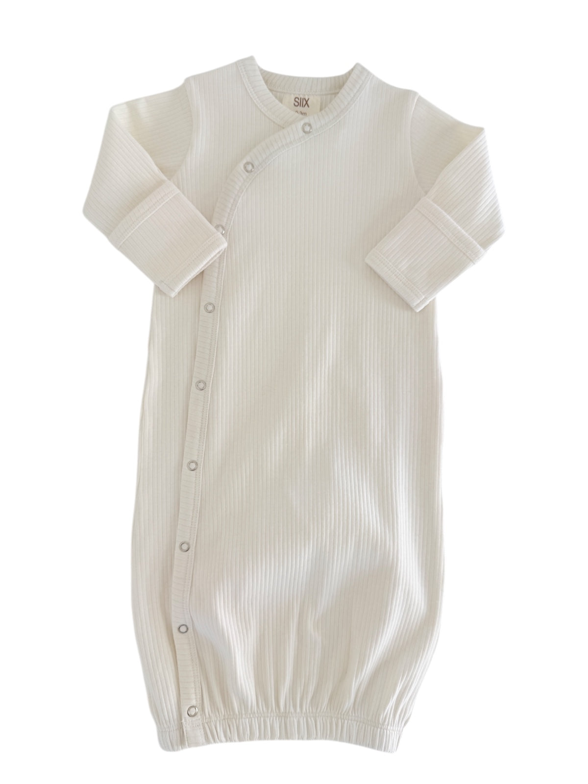 Cream-colored baby sleeping gown with ribbed texture and snap buttons along the side.