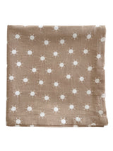 Brown fabric with white sun patterns folded neatly. Ideal for decor or crafting projects.