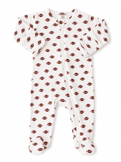Baby onesie with a football pattern in red on a white background, featuring a zip closure and footed design.