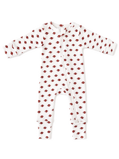 White baby onesie with red football patterns, featuring long sleeves and a front zipper closure.
