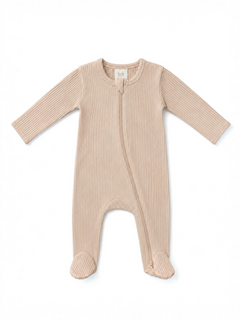 Beige ribbed baby onesie with long sleeves and zip front closure, featuring footed design for warmth.