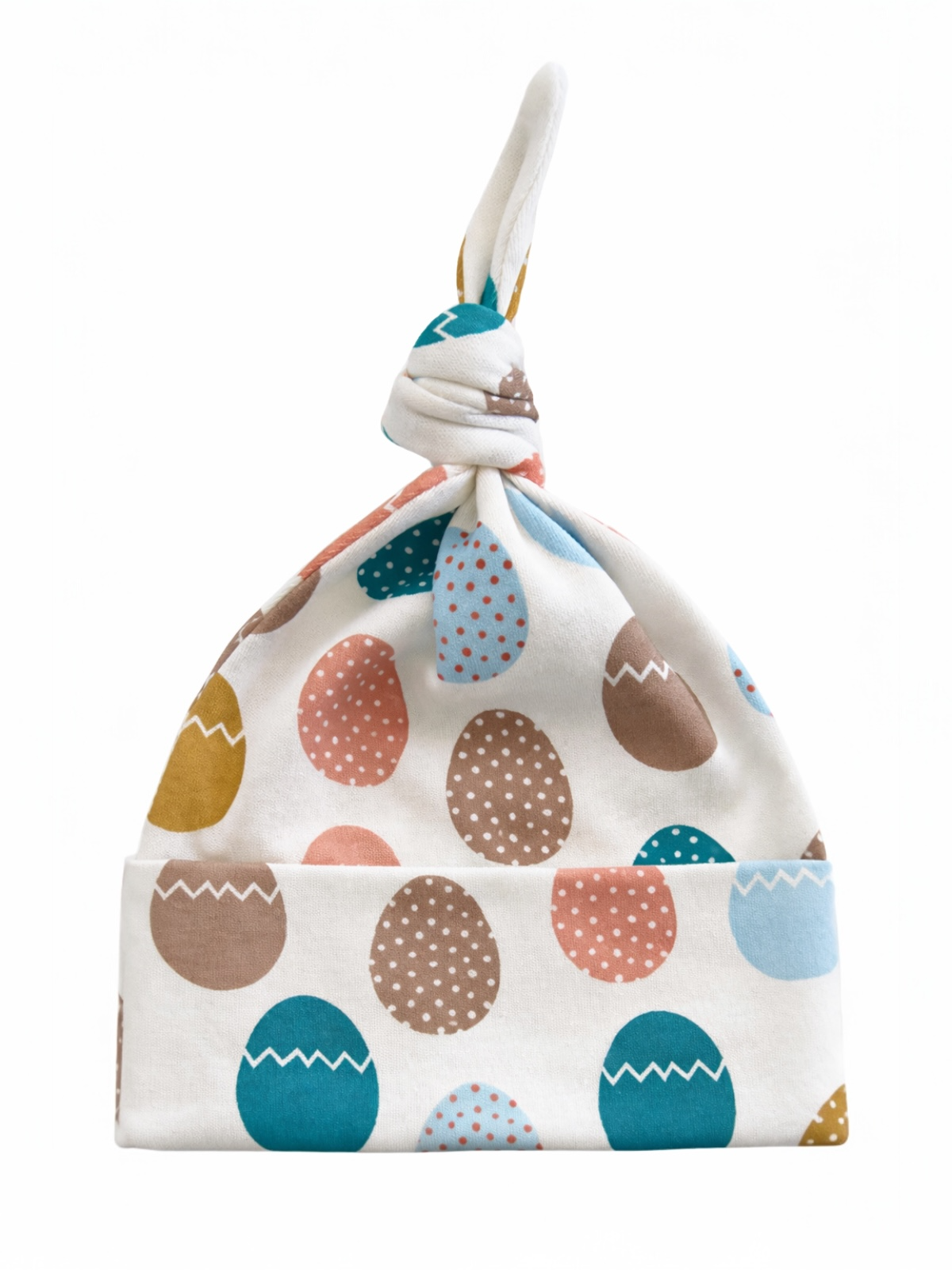 Baby hat with colorful egg patterns, featuring a knot design on top. Ideal for infants and festive occasions.