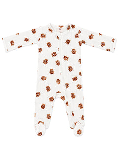 White baby sleeper with brown teddy bear print, featuring full sleeves and footed design.