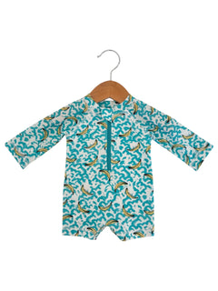 Children's swim romper with banana print, hanging on a wooden hanger against a white background.