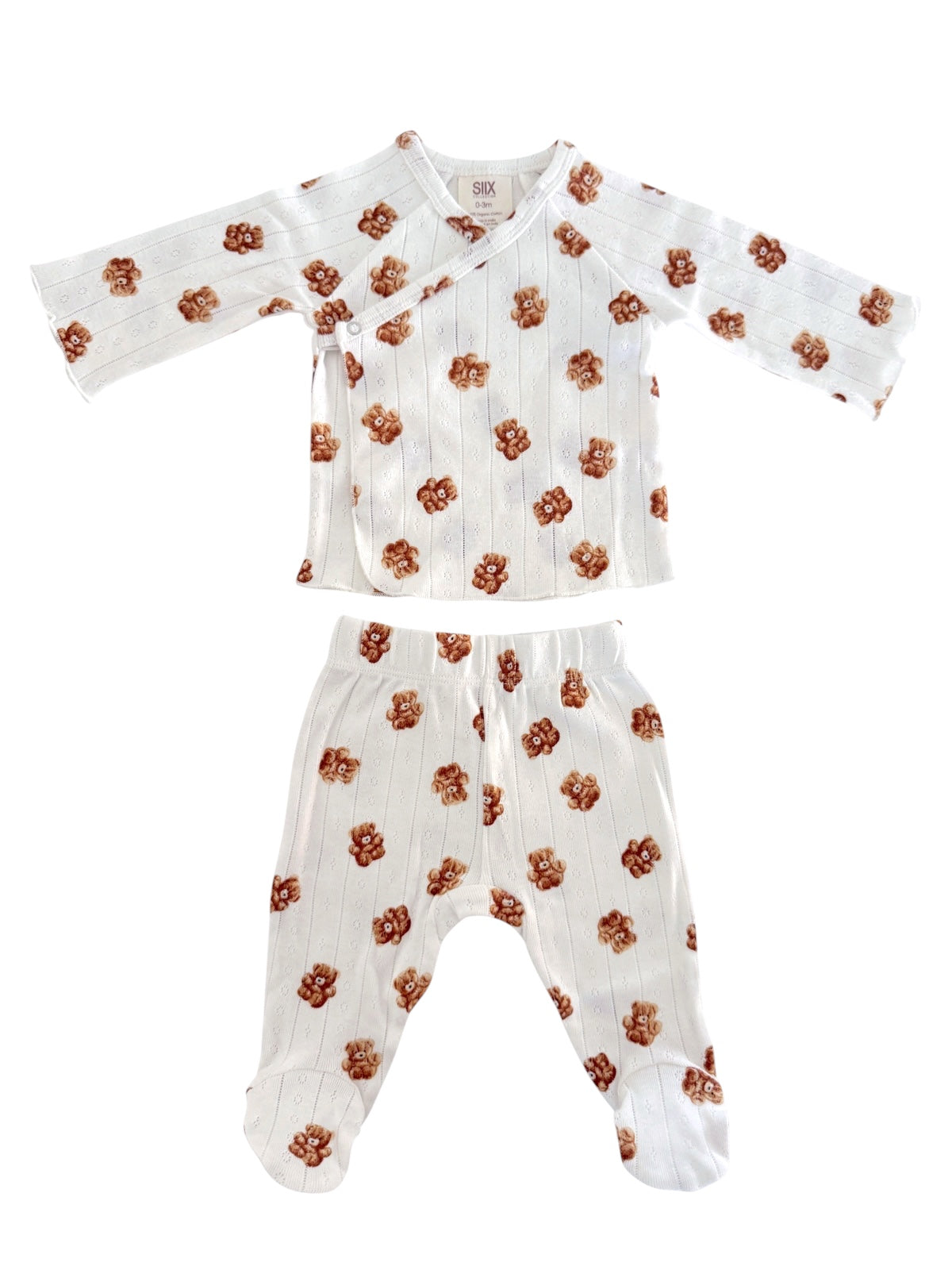 White baby outfit with floral pattern, featuring a long-sleeve top and matching pants.