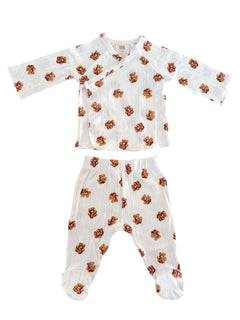 White baby outfit with floral pattern, featuring a long-sleeve top and matching pants.