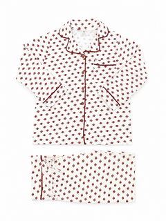 White pajama set with red and black patterned design and piped detailing. Includes a button-up shirt and pants.