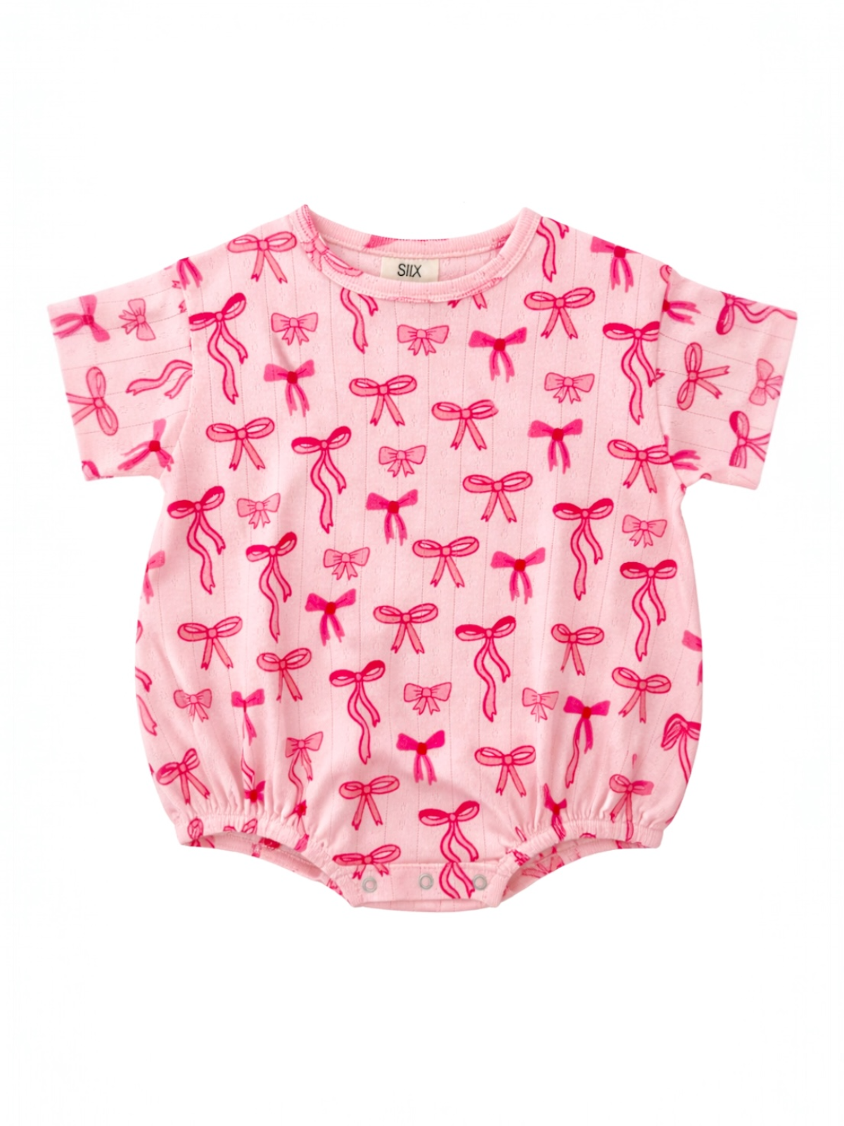 Pink baby onesie with a pattern of bright pink bows, short sleeves, and gathered bottom.