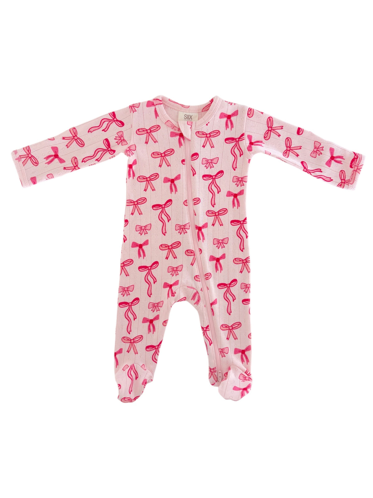 Pink baby onesie featuring a playful bow pattern and a front zipper. Ideal for cozy and cute infant wear.