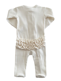 Cream-colored baby onesie with ribbed texture and ruffled detail at the waist, viewed from the back.