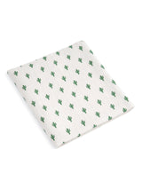 White fabric with a repeating cactus pattern in green.