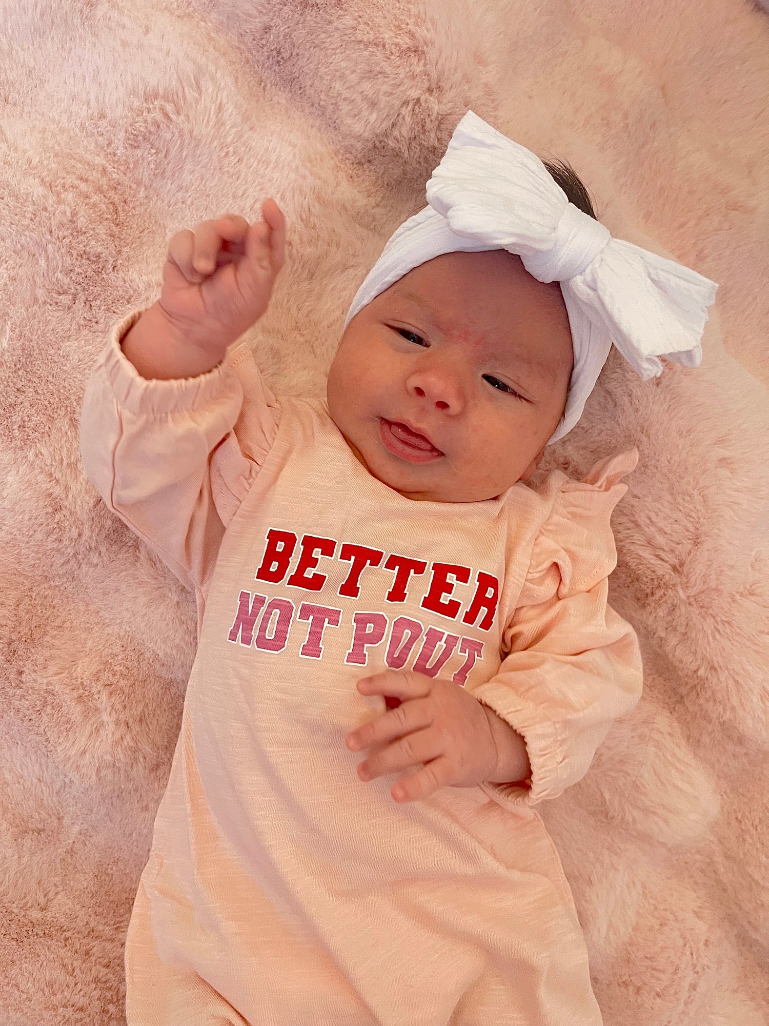 Smiling baby wearing a 