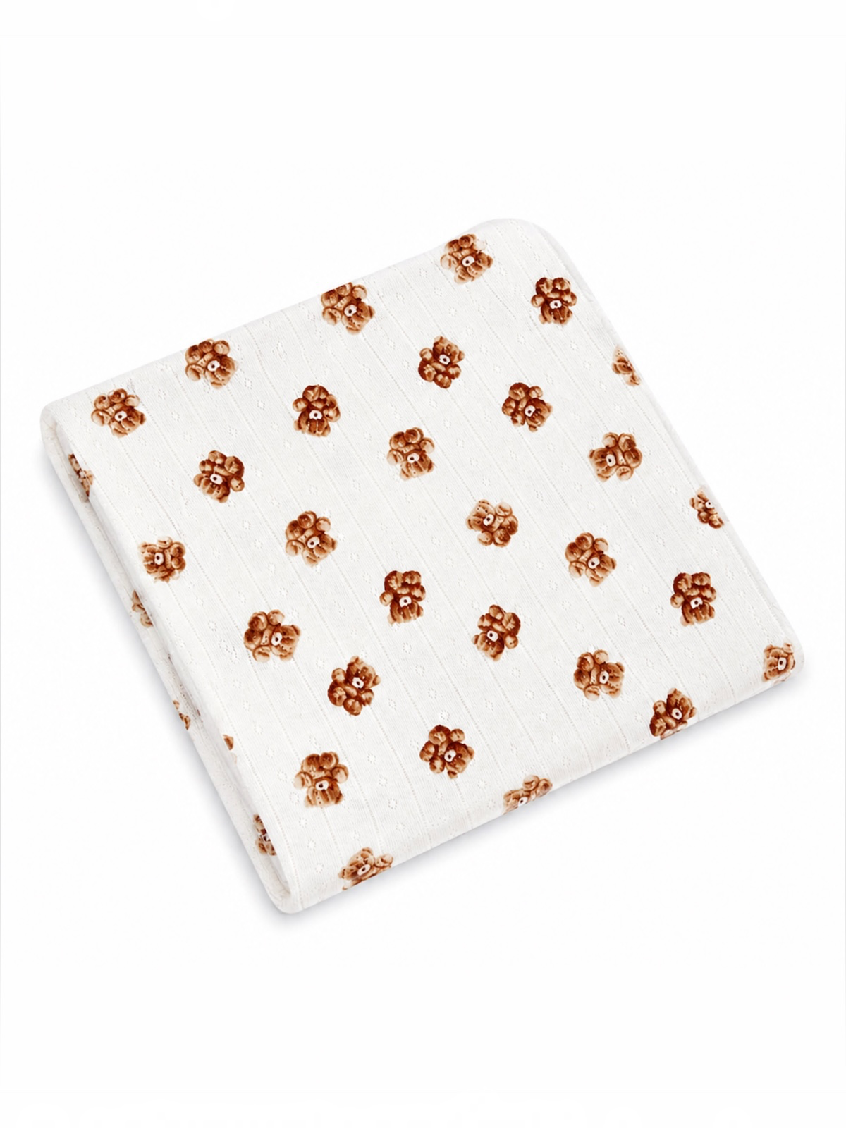 White blanket featuring a repeated floral pattern in shades of brown. Soft and cozy design.
