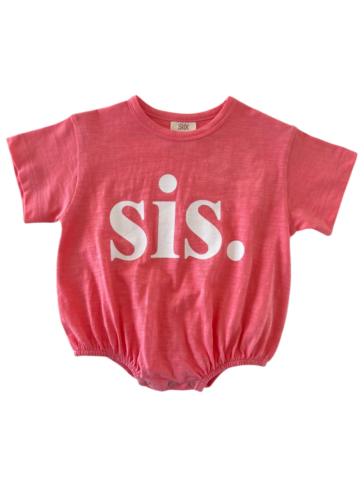 Pink baby onesie with white text that says 