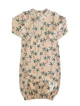 Baby sleep sack featuring a palm tree print on a light background, soft fabric, and snap closure design.