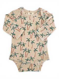 Beige baby bodysuit with palm tree print, featuring long sleeves and snap buttons at the bottom.