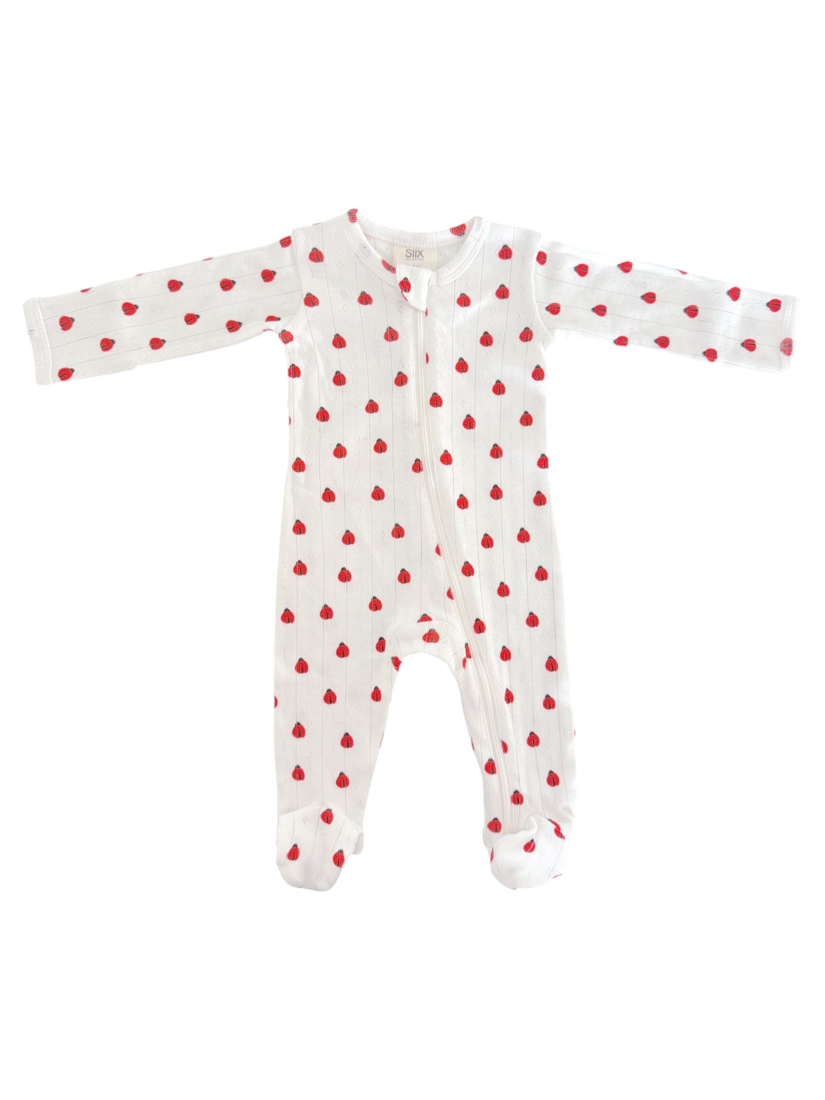 White baby onesie adorned with small red hearts, featuring long sleeves and a front zipper.