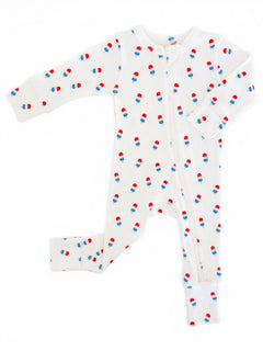 White baby onesie with colorful popsicle patterns, featuring long sleeves and a front zipper.