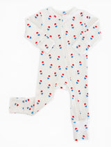 White baby onesie with red and blue popsicle pattern, featuring long sleeves and a zipper closure.