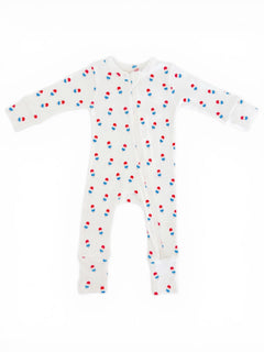 Light-colored baby onesie with red, blue, and white popsicle prints, featuring long sleeves and a front zipper.