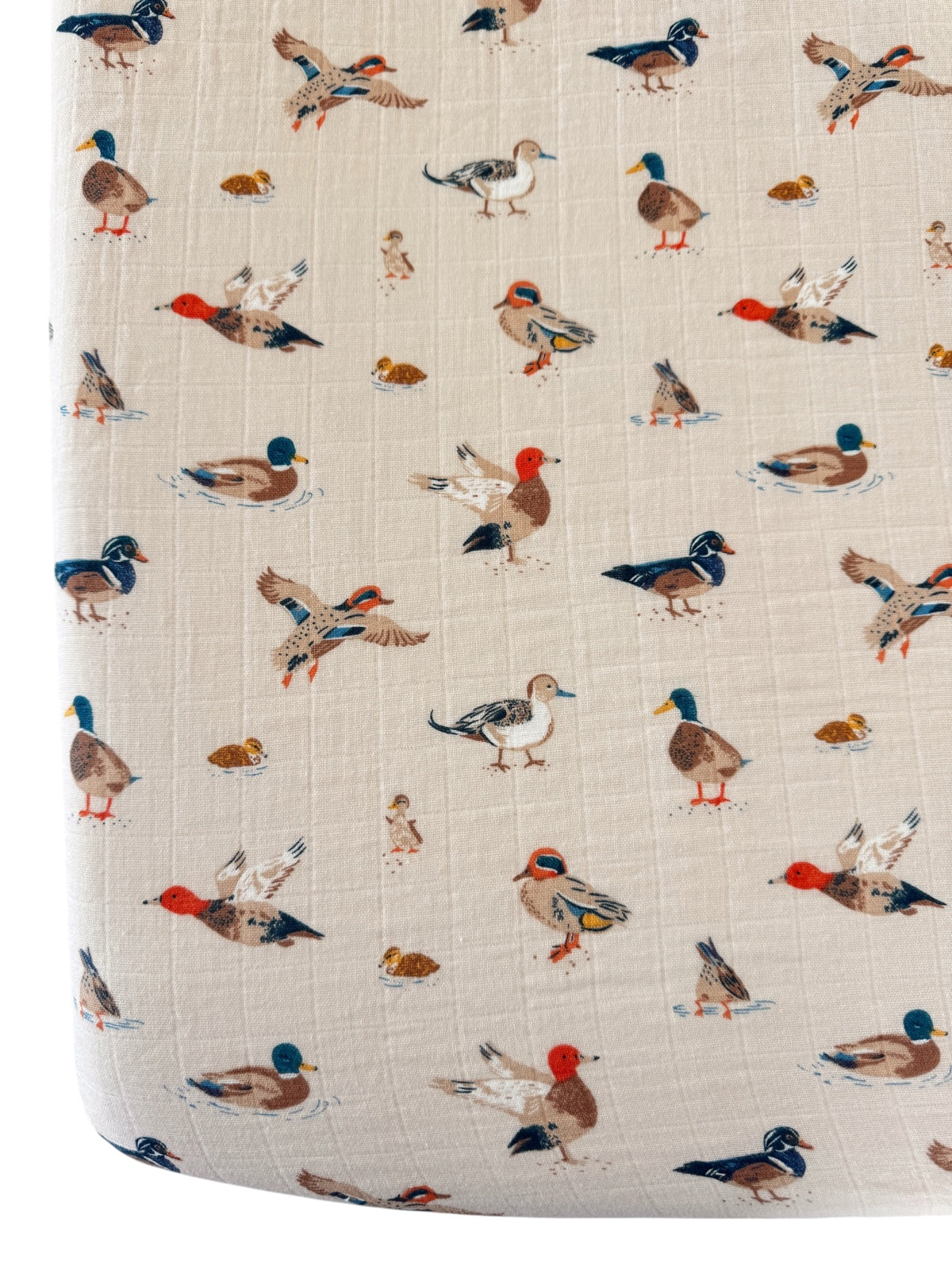 Pattern of colorful ducks and birds on a light background, ideal for decor or fabric design.