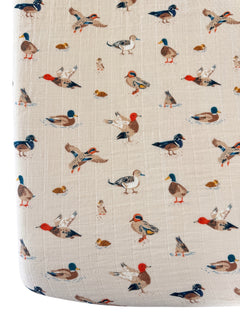 Pattern of colorful ducks and birds on a light background, ideal for decor or fabric design.