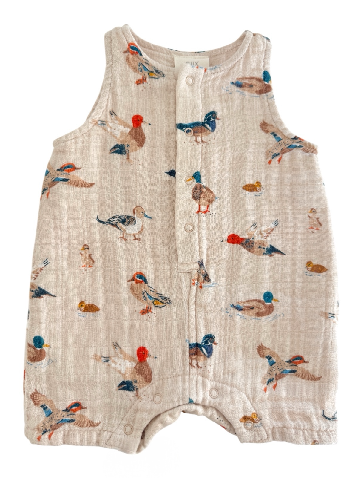 Light beige infant romper with colorful bird prints, featuring buttons down the front for easy dressing.