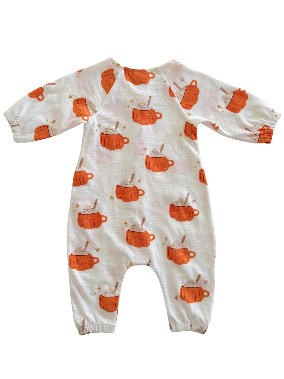 Cute baby onesie covered in orange mugs with treats and stars against a white background. Ideal for cozy wear.