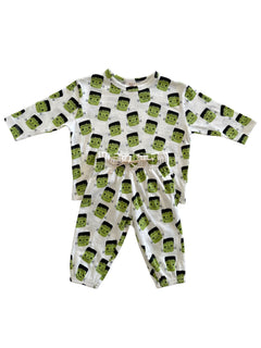 Frankenstein-themed pajama set featuring a long-sleeve top and elastic waistband pants, both with playful print.