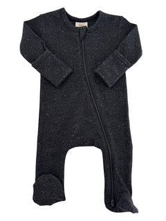 Black infant bodysuit with colorful specks and a front zipper, featuring long sleeves and footed design.