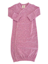 Light pink baby gown with long sleeves and snap buttons, featuring a soft, speckled texture.