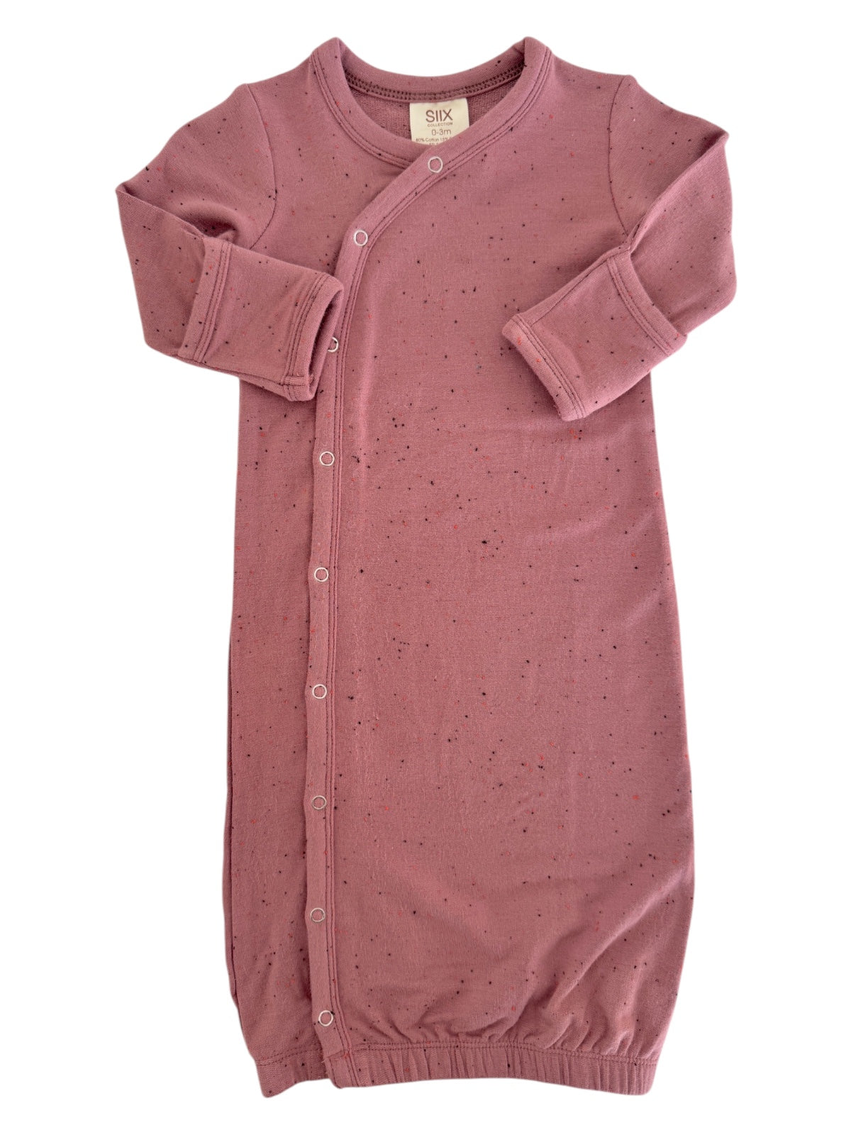 Pink baby sleeper with long sleeves and snap buttons, designed for comfort and ease of dressing.