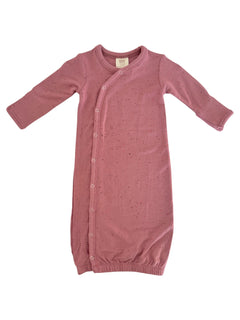 Light pink baby gown with long sleeves and button closure, featuring a ribbed neckline and gathered bottom.