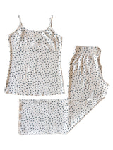 White tank top and matching pants with navy blue star print, laid flat on a white background.